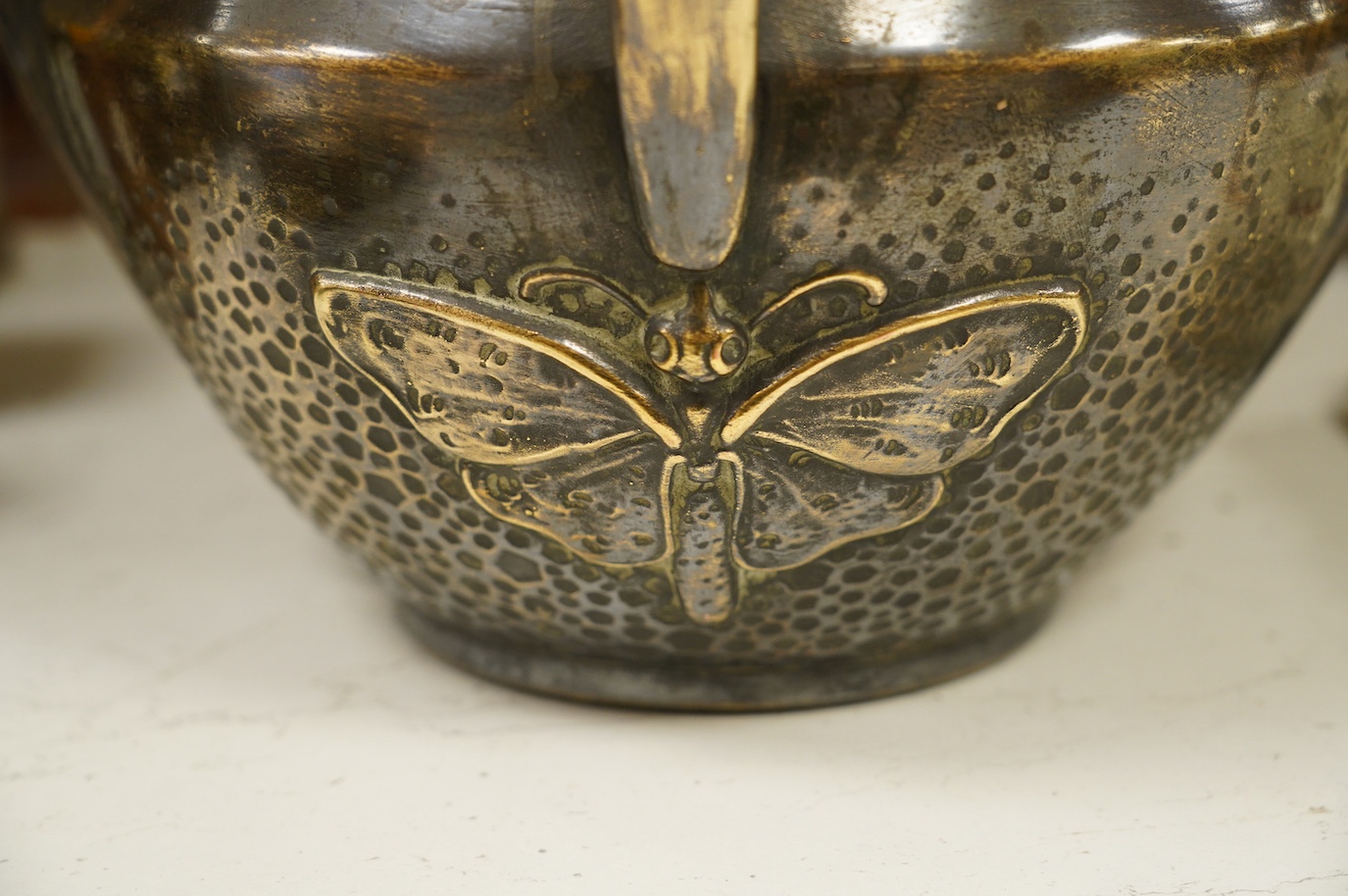 Bruyn, a porcelain Art Nouveau 'butterfly' planter with applied copper skin, signed to the base and numbered 4611, 28.5cm diameter, 23cm high. Condition - fair, some damage mainly to the surface